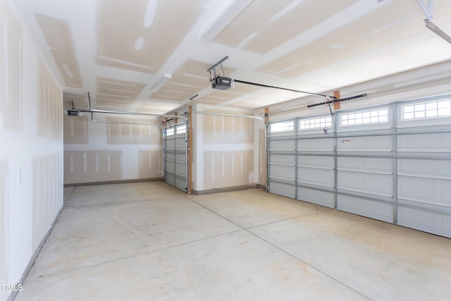 garage featuring a garage door opener