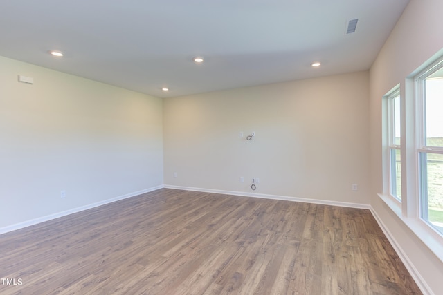 unfurnished room featuring hardwood / wood-style floors