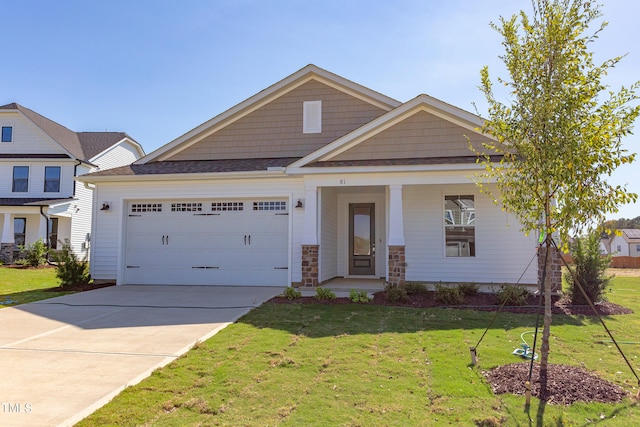 craftsman-style house with a garage and a front lawn