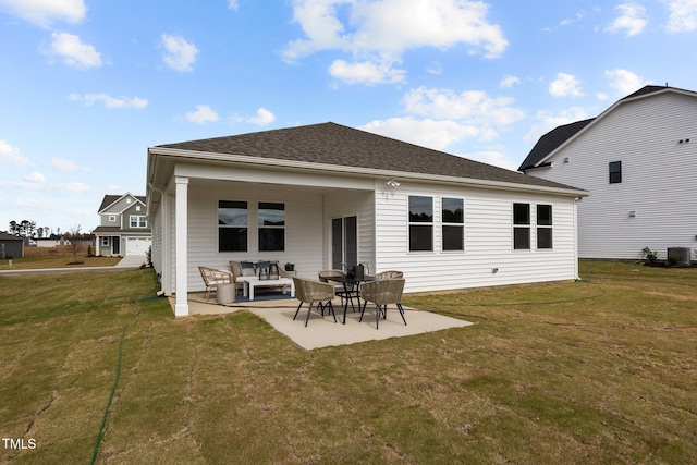 rear view of property with central AC unit, a yard, and a patio