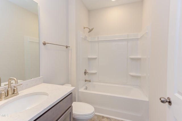 full bathroom featuring vanity, bathtub / shower combination, and toilet