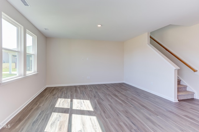 spare room with light hardwood / wood-style flooring