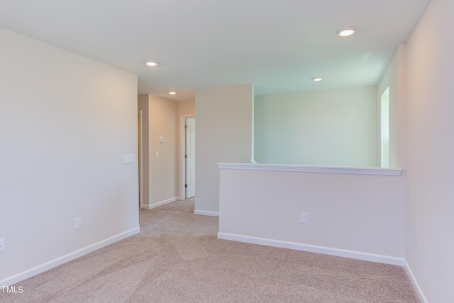 empty room featuring light colored carpet