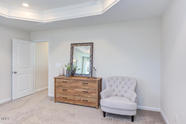 living area with a raised ceiling, crown molding, and light carpet