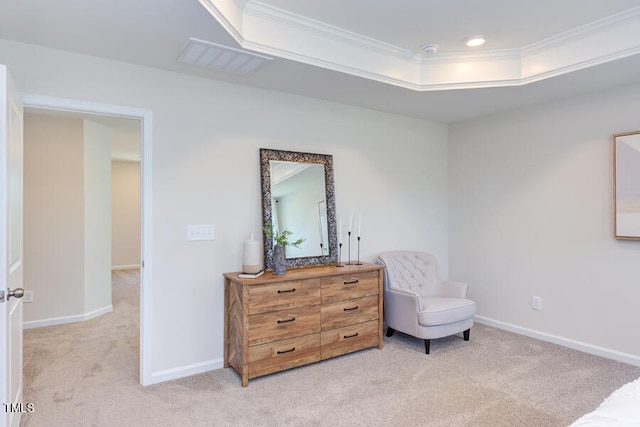 sitting room with light carpet, a tray ceiling, and crown molding