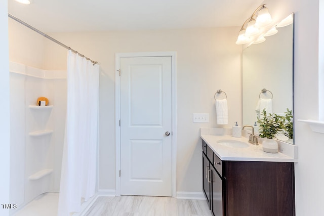 bathroom featuring vanity and walk in shower