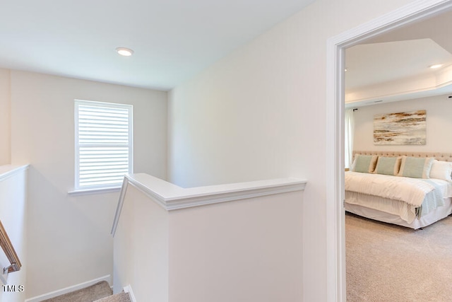 hallway with carpet floors