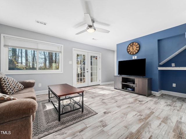 4236 Lake Ridge Dr, Raleigh, NC 27604 - living room featuring french doors, ceiling fan, and light hardwood / wood-style floors