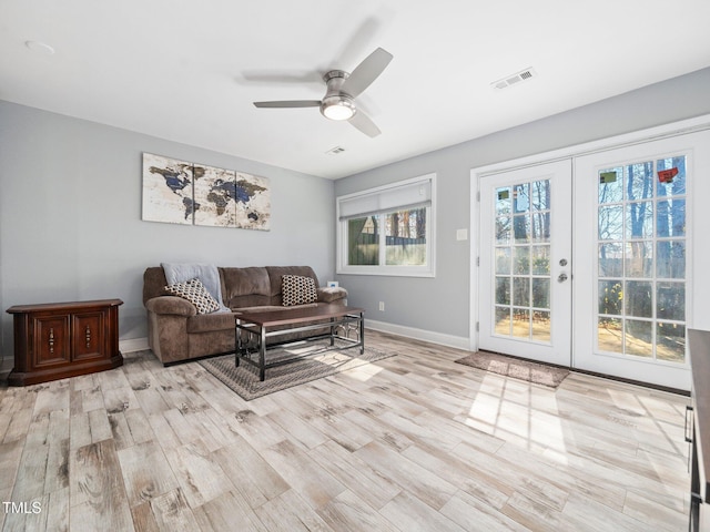 4236 Lake Ridge Dr, Raleigh, NC 27604 - living room featuring french doors, ceiling fan, and light hardwood / wood-style flooring