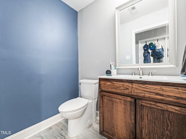 4236 Lake Ridge Dr, Raleigh, NC 27604 - bathroom with vanity, toilet, and hardwood / wood-style floors
