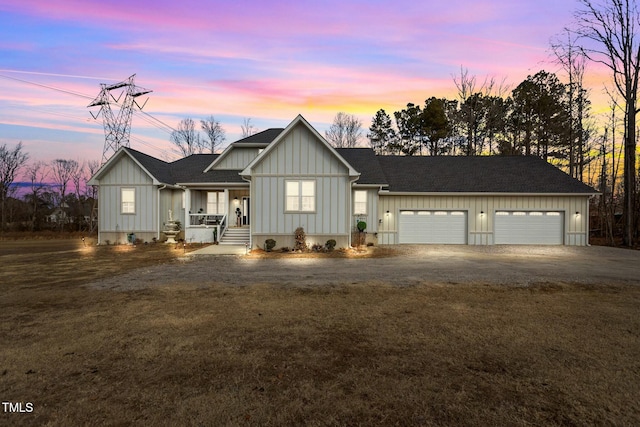 view of front of home featuring a garage and a lawn