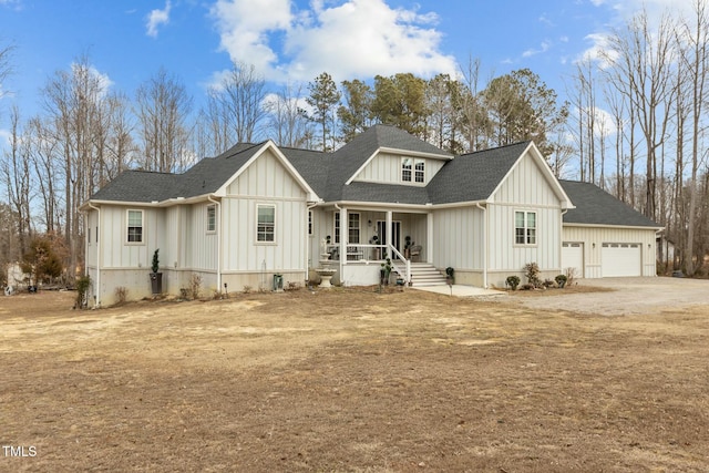 modern farmhouse with a garage and covered porch