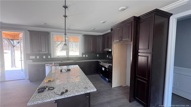 kitchen with dishwasher, sink, ornamental molding, a center island, and dark brown cabinets