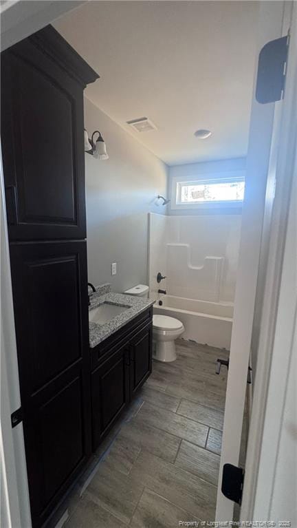 full bathroom with vanity, toilet, and bathing tub / shower combination