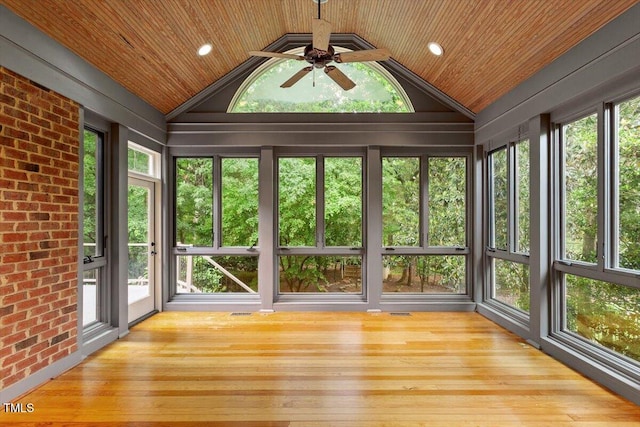 unfurnished sunroom with wooden ceiling, lofted ceiling, and hardwood / wood-style flooring