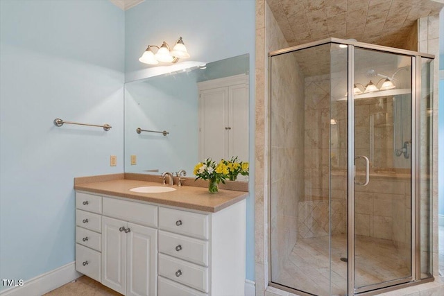 bathroom featuring a stall shower and vanity