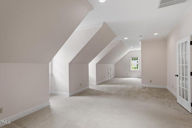 additional living space featuring carpet floors, recessed lighting, baseboards, lofted ceiling, and french doors