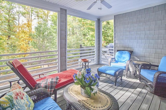 sunroom / solarium with ceiling fan