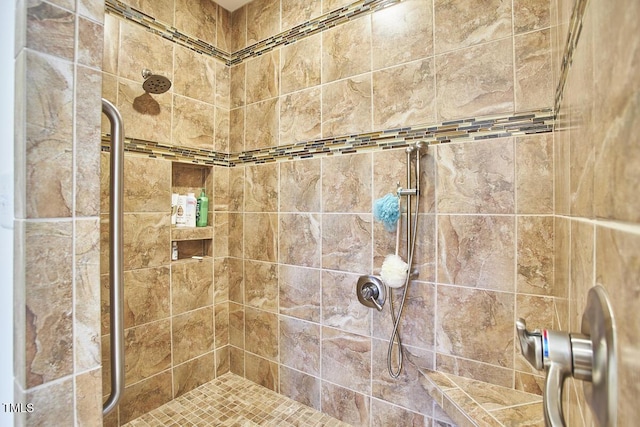 bathroom featuring tiled shower