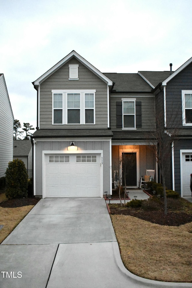 view of front of house featuring a garage and a front yard