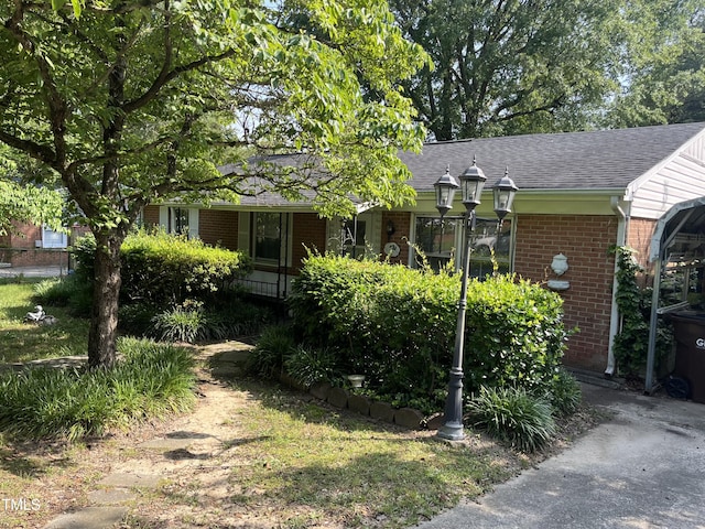 2612 Academy St, Sanford, NC 27332 - ranch-style home featuring brick siding and a shingled roof
