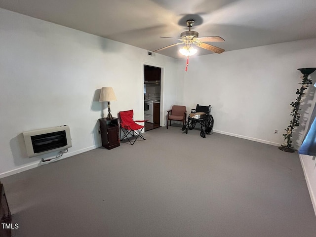 2612 Academy St, Sanford, NC 27332 - sitting room featuring heating unit, carpet, ceiling fan, and baseboards