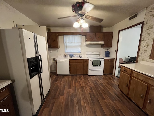 2612 Academy St, Sanford, NC 27332 - kitchen featuring white appliances, under cabinet range hood, ceiling fan, dark wood finished floors, and light countertops
