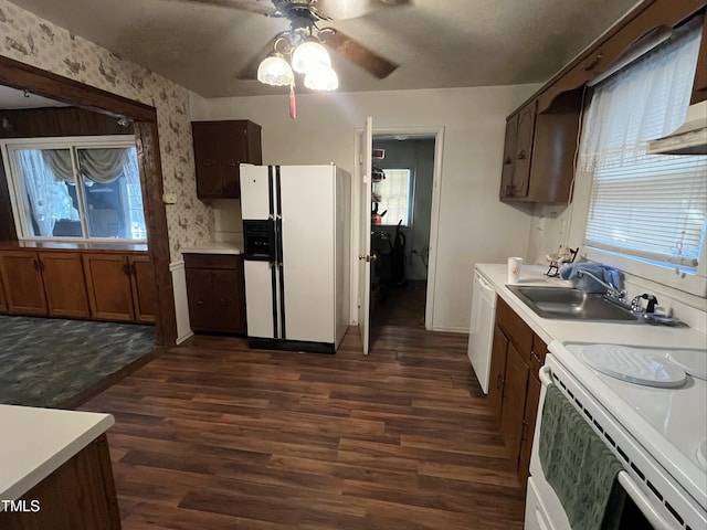 2612 Academy St, Sanford, NC 27332 - kitchen featuring white appliances, a sink, ceiling fan, light countertops, and dark wood finished floors