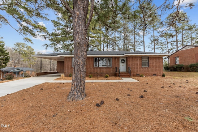 ranch-style home featuring a carport