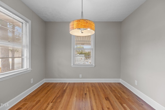 empty room featuring hardwood / wood-style flooring