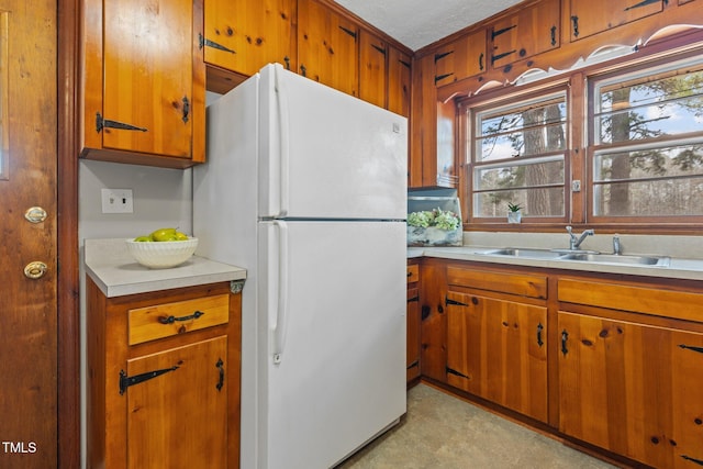 kitchen with white refrigerator and sink