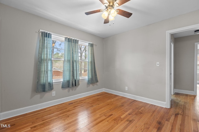 unfurnished room featuring ceiling fan and wood-type flooring