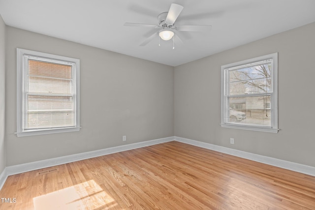 unfurnished room featuring ceiling fan and light wood-type flooring