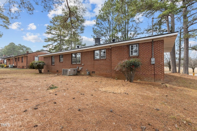 back of house featuring central AC