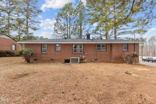 back of house featuring central air condition unit