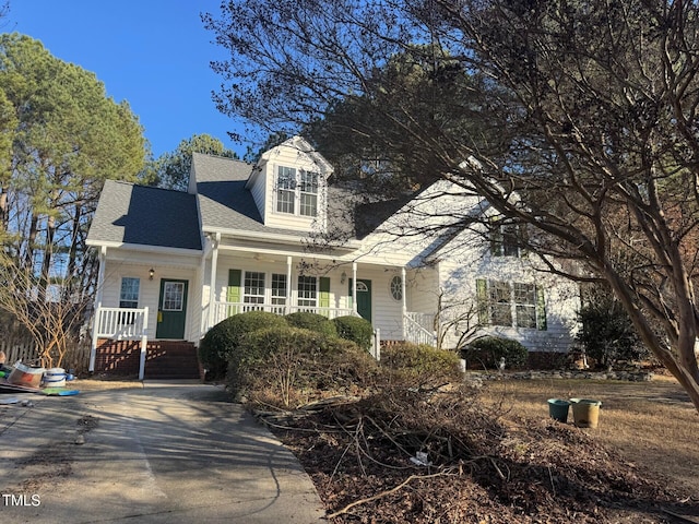 cape cod home with a porch