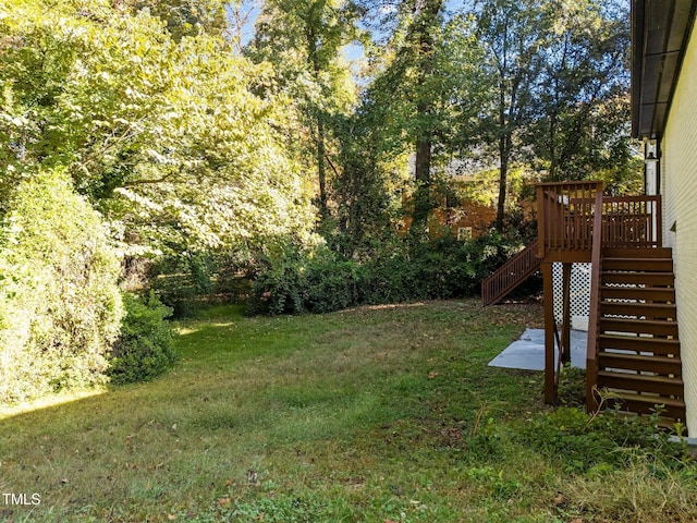 view of yard with a wooden deck