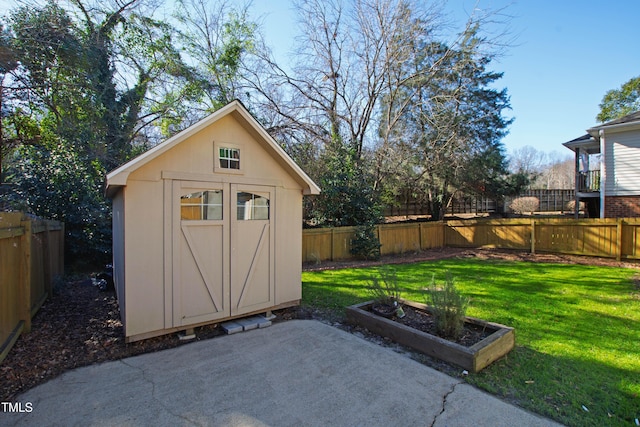 view of outbuilding with a yard