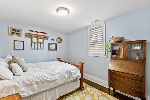 bedroom featuring dark wood-type flooring