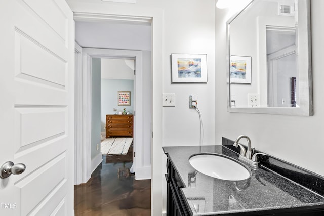 bathroom featuring vanity and wood-type flooring