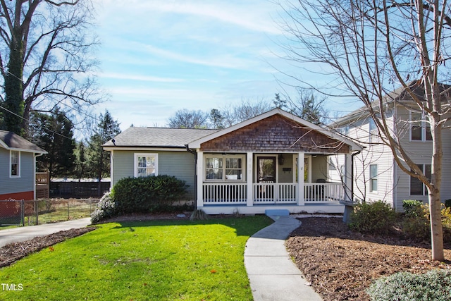 bungalow-style house with a porch and a front yard