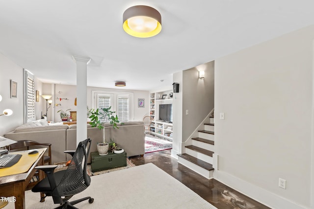 home office featuring built in features and ornate columns