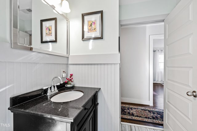 bathroom featuring vanity and hardwood / wood-style floors