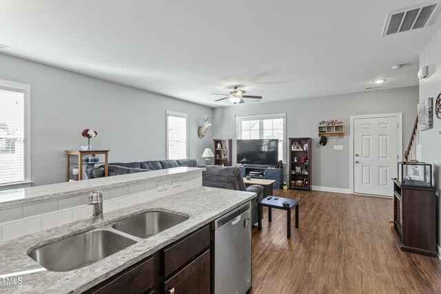 105 Langdon Chase Way, Selma, NC 27576 - kitchen featuring visible vents, dishwasher, dark brown cabinets, a sink, and dark wood-style floors