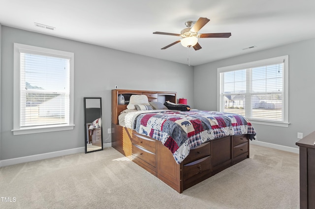 105 Langdon Chase Way, Selma, NC 27576 - bedroom with a ceiling fan, baseboards, light colored carpet, and visible vents