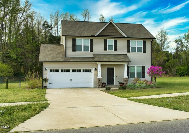 105 Langdon Chase Way, Selma, NC 27576 - view of front of property featuring a front yard, driveway, a garage, and fence