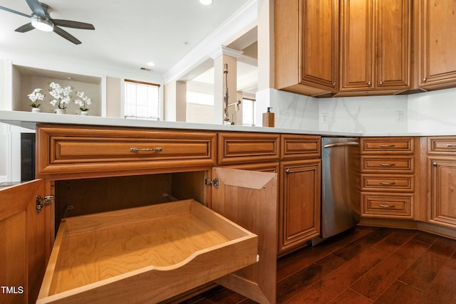 kitchen with crown molding, dark wood-type flooring, ceiling fan, and decorative backsplash