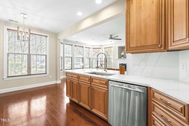 kitchen featuring pendant lighting, sink, dark wood-type flooring, decorative backsplash, and stainless steel dishwasher