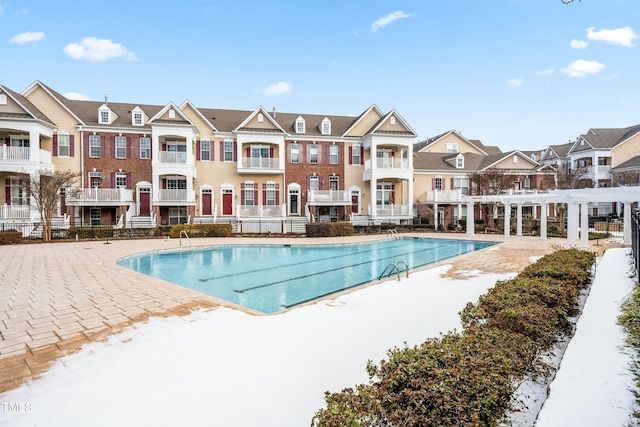 view of swimming pool with a patio