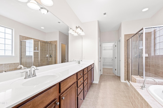 bathroom featuring vanity, tile patterned flooring, and independent shower and bath